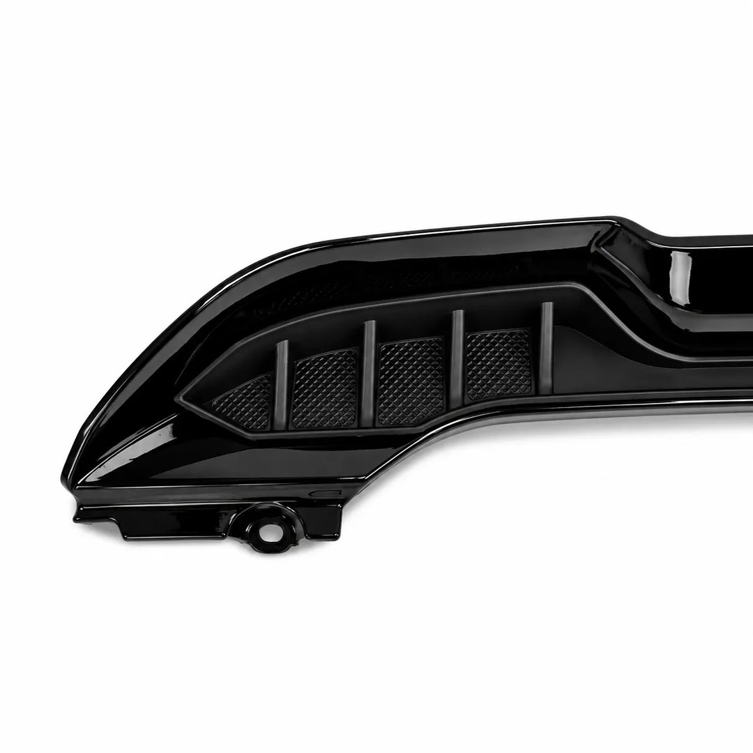 A glossy black automotive Spoiler Lip trim piece with textured mesh vents, shown on a clean white background.