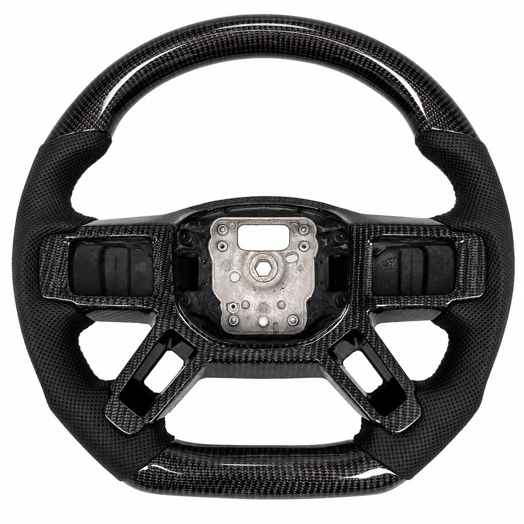 A carbon fiber steering wheel kit shown in one piece: a carbon top and bottom half of a steering wheel, and a matching inner center wheel trim piece below, on a solid white background.