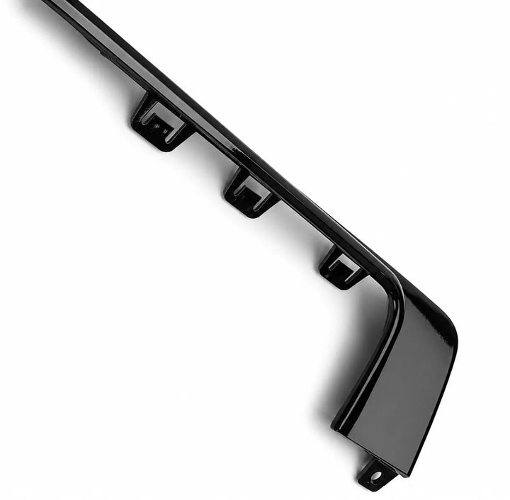 A glossy black plastic automotive trim piece or bumper lip component, shown at an angle on a clean white background.