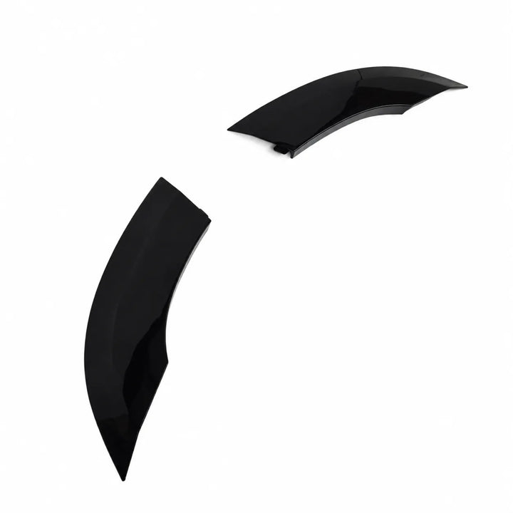Two small plastic Sterling automotive wheel arches fender covers on a plain white background, 2 piece arch set gloss black abs