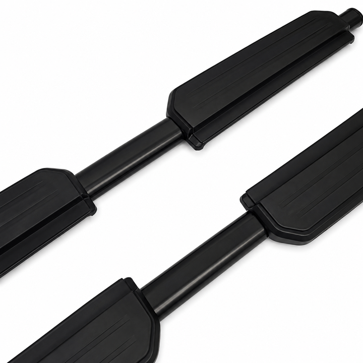 A pair of black metal and rubber side steps shown diagonally on a plain white background.