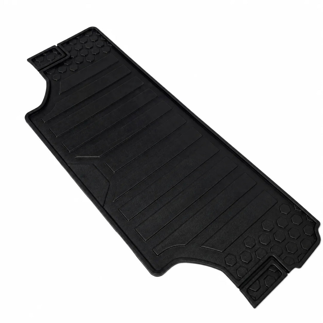 A black rubber vehicle floor mat with textured grip patterns and molded ridges, shown on a plain white background.