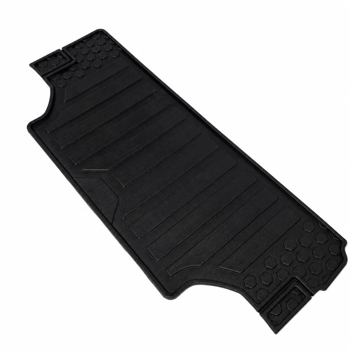 A black rubber vehicle floor mat with textured grip patterns and molded ridges, shown on a plain white background.