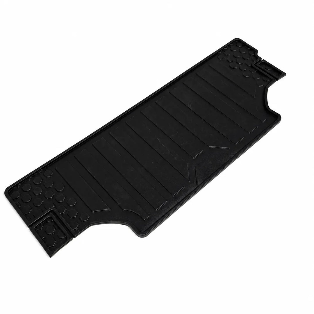 A black rubber cargo floor mat with textured ridges and raised bumpers, shown on a plain white background.