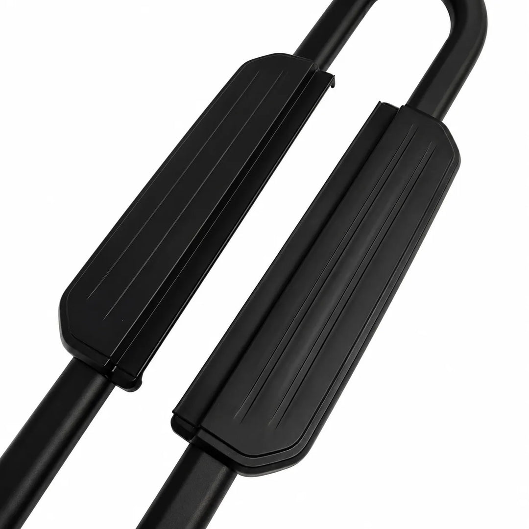 Close-up of black metal and rubber foot grips on a fitness bar, shown against a plain white background.