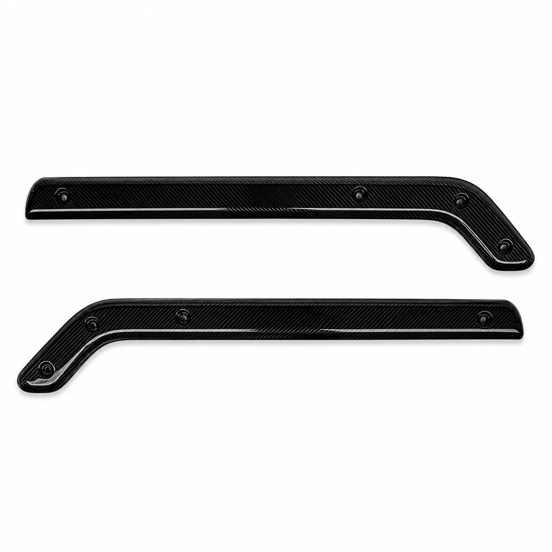 A pair of black carbon fiber textured trim pieces with a glossy finish, shown against a plain white background.