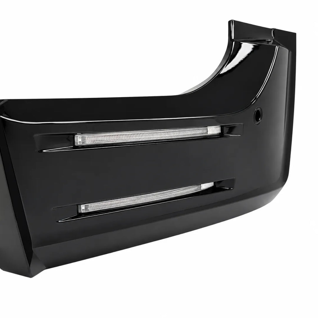 A glossy black automotive bumper insert with integrated horizontal LED light bars, shown on a plain white background.