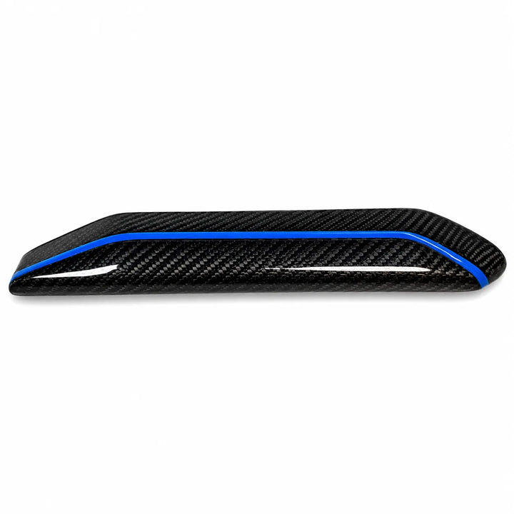 A glossy carbon fiber trim piece with a distinctive blue accent line, shown against a plain white background.
