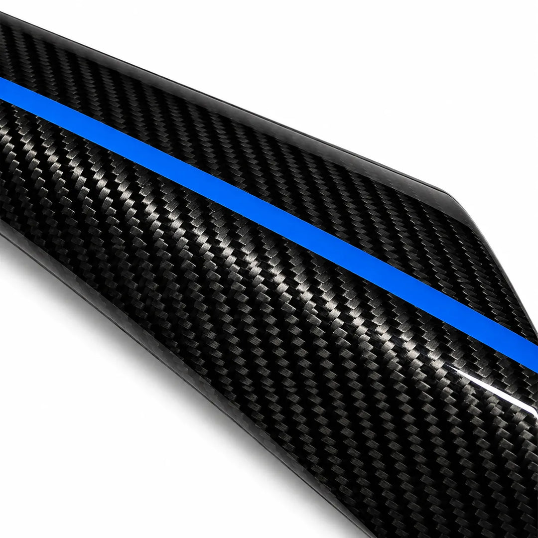 A close-up of a glossy black carbon fiber textured surface with a bold bright blue stripe running diagonally across it, shown on a white background.