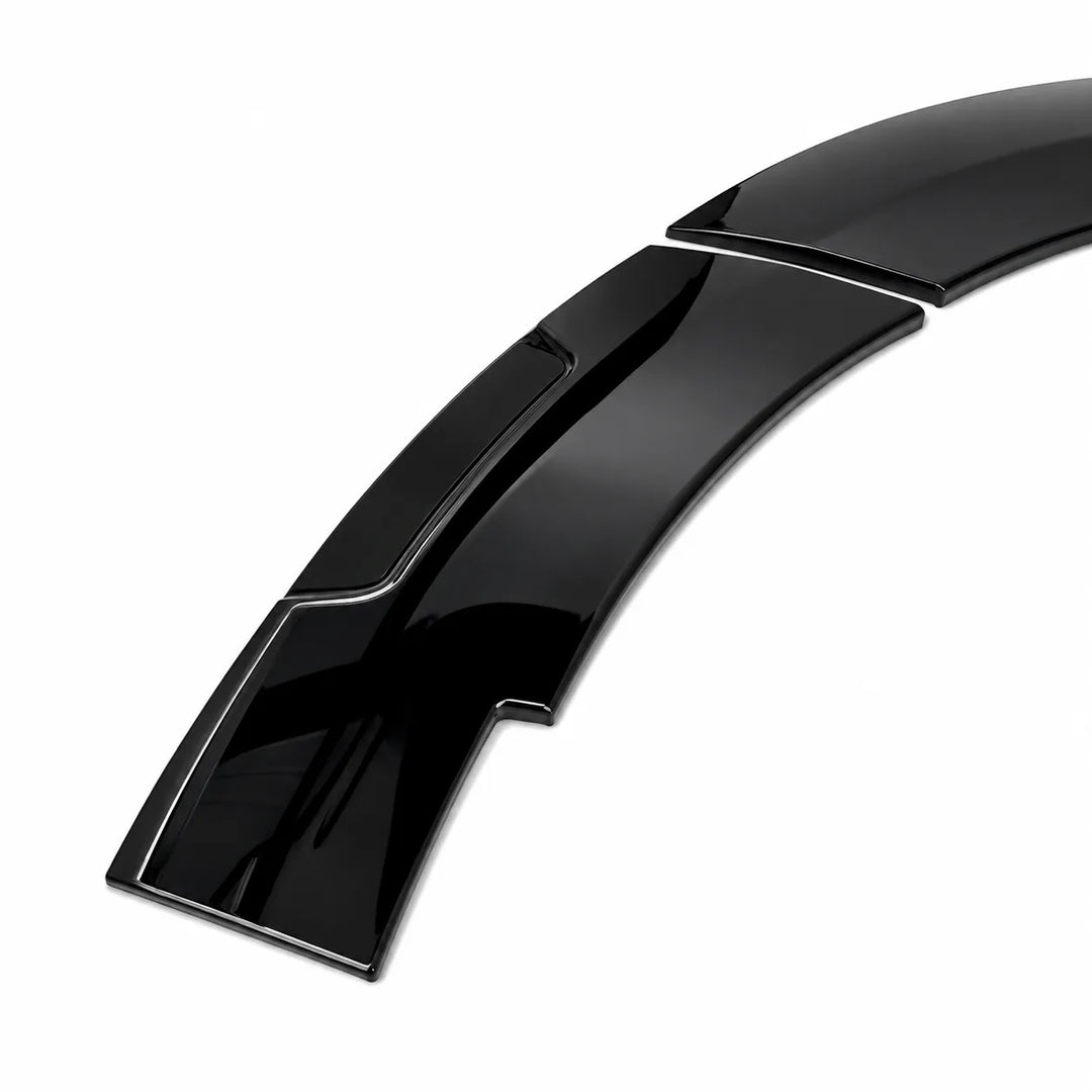 A glossy black curved automotive wheel arch lip badges, with aggressive styling for ford van displayed on a clean white background.
