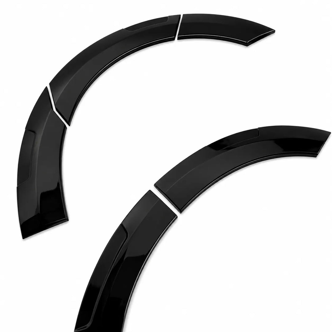 Two glossy black curved automotive wheel arches or fender trim pieces on a plain white background.