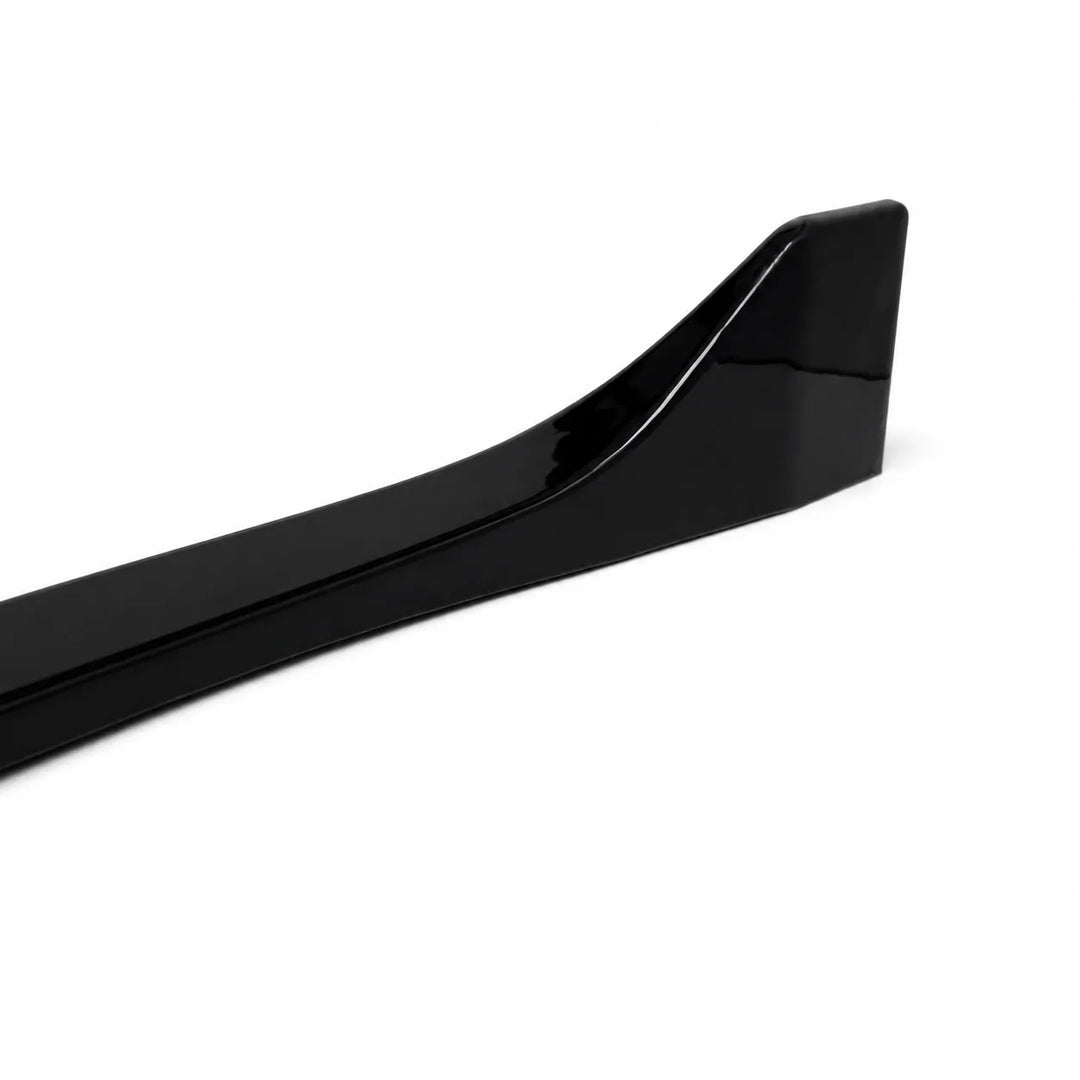 A glossy black plastic automotive trim piece, side skirt fender trim, shown on a plain white background.