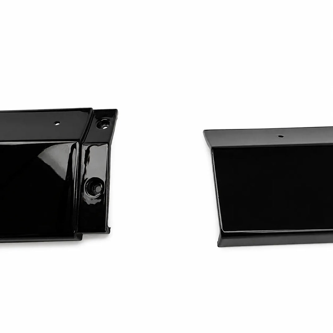 Two glossy black plastic automotive trim pieces, likely bumper lip guards or side marker covers, shown on a plain white background.