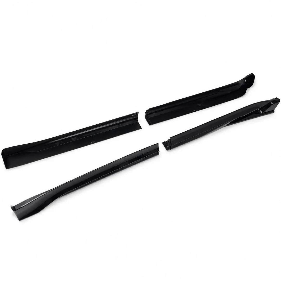 A set of four black plastic automotive trim pieces, including two long side moldings and two shorter inner trim pieces, displayed on a clean white background.