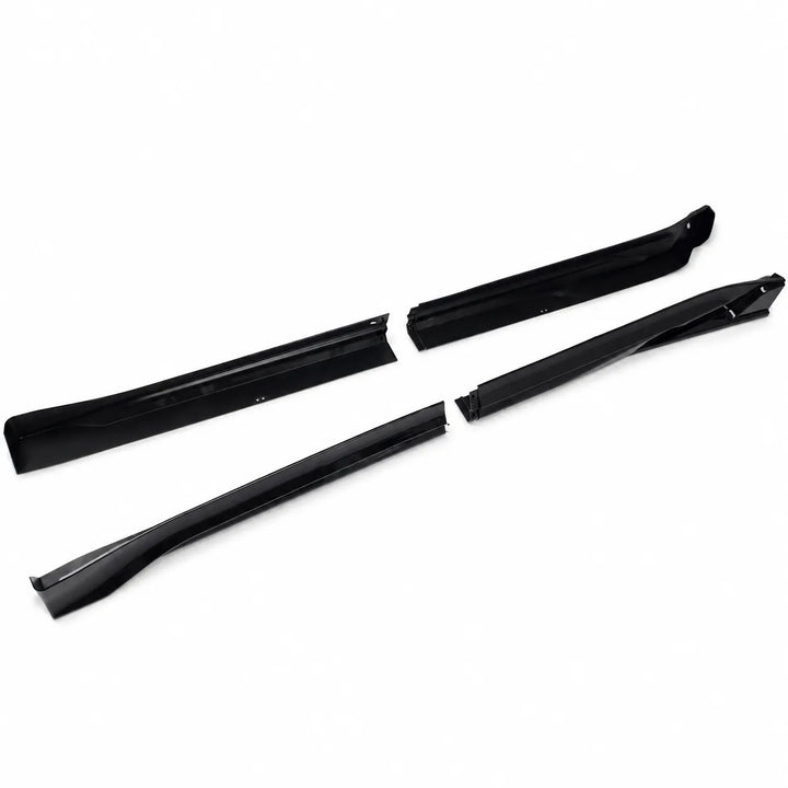 A set of four black plastic automotive trim pieces, including two long side moldings and two shorter inner trim pieces, displayed on a clean white background.