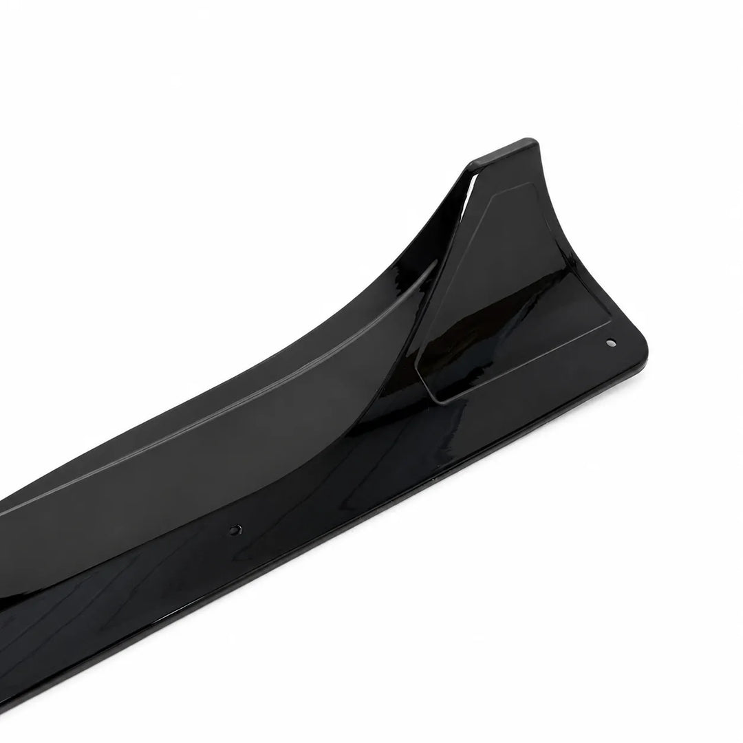 A close up shot Tesla Model Y pair of black side skirts, long black side skirt pieces displayed below on a white background. 