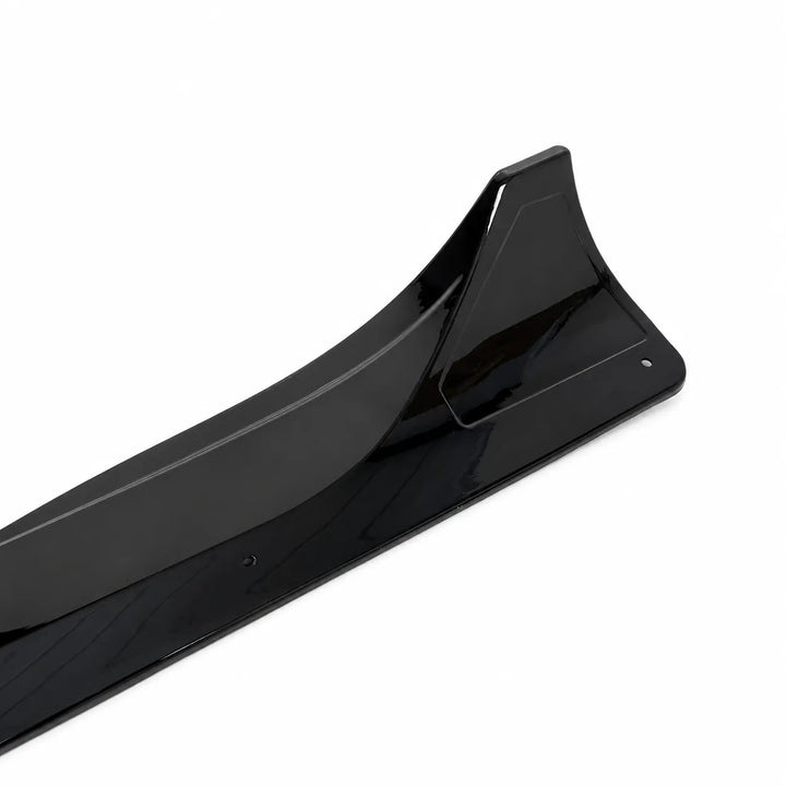 A close up shot Tesla Model Y pair of black side skirts, long black side skirt pieces displayed below on a white background. 