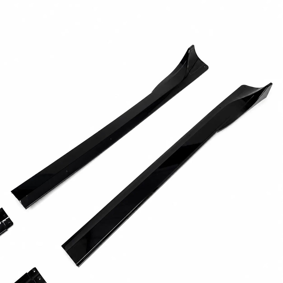 A Tesla Model Y pair of black side skirts, long black side skirt partial pieces displayed below on a white background. 
