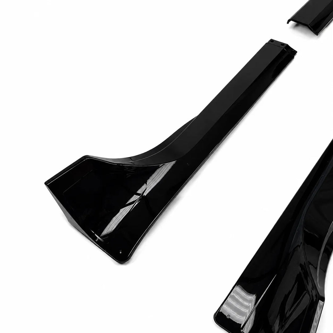 pair of black small side side skirts, long black side skirt pieces displayed below on a white background. 