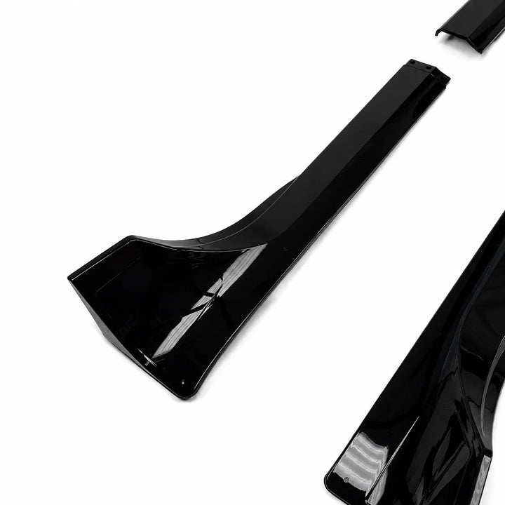 pair of black small side side skirts, long black side skirt pieces displayed below on a white background. 