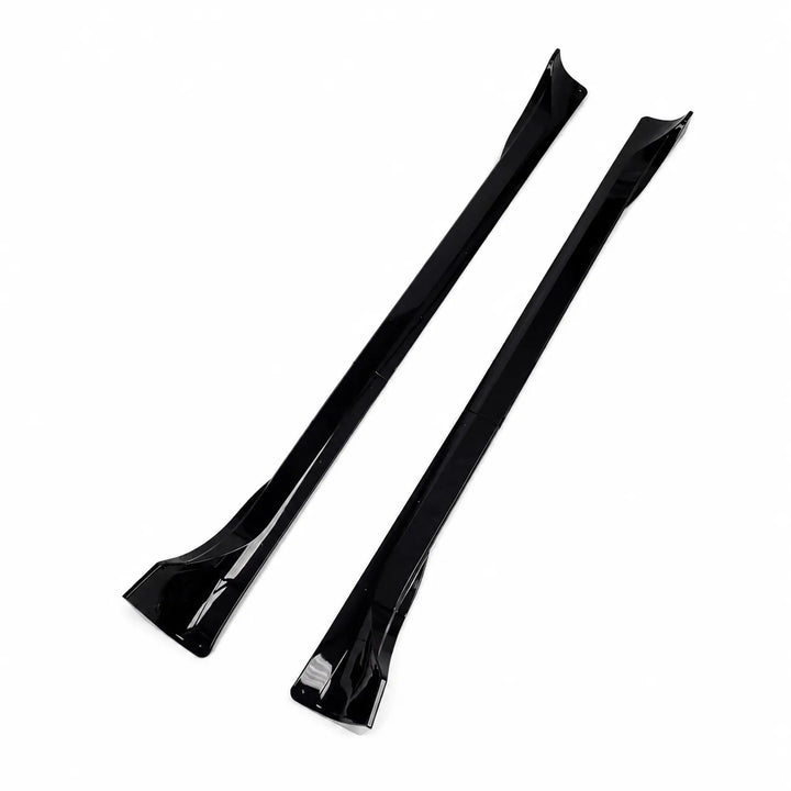 A Tesla Model Y pair of black side skirts, long black side skirt pieces displayed below on a white background. 