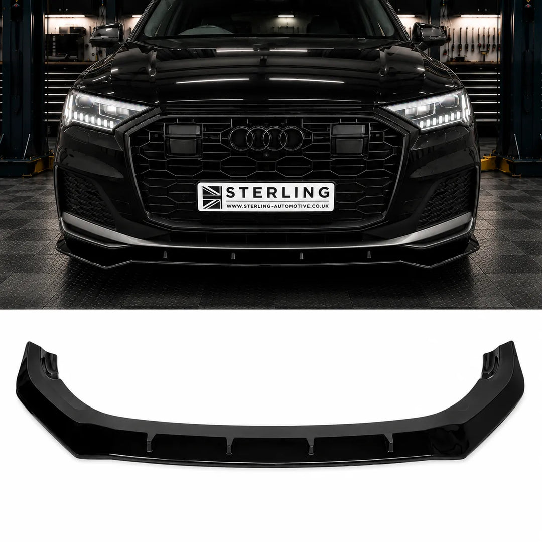 A black glossy automotive front lip spoiler bumper splitter shown below, with a black Audi q7 vehicle above on the sterling workshop floor. The license plate area on the car reads STERLING. product displayed on the bottom 