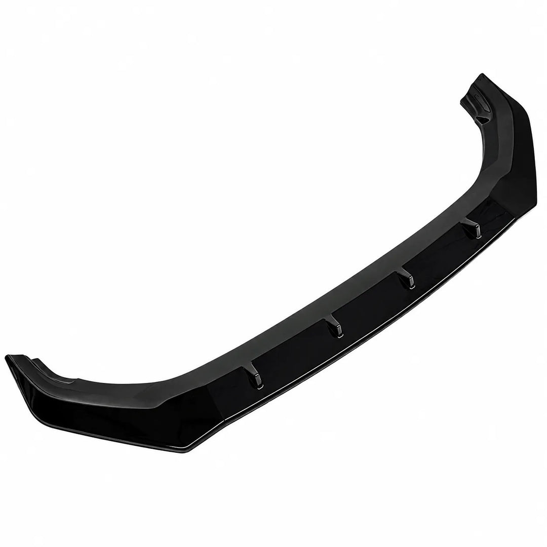 A glossy black automotive front bumper lip or splitter trim piece make for audi q7 sq7, angled image of one piece splitter valance shown from against a solid white background.