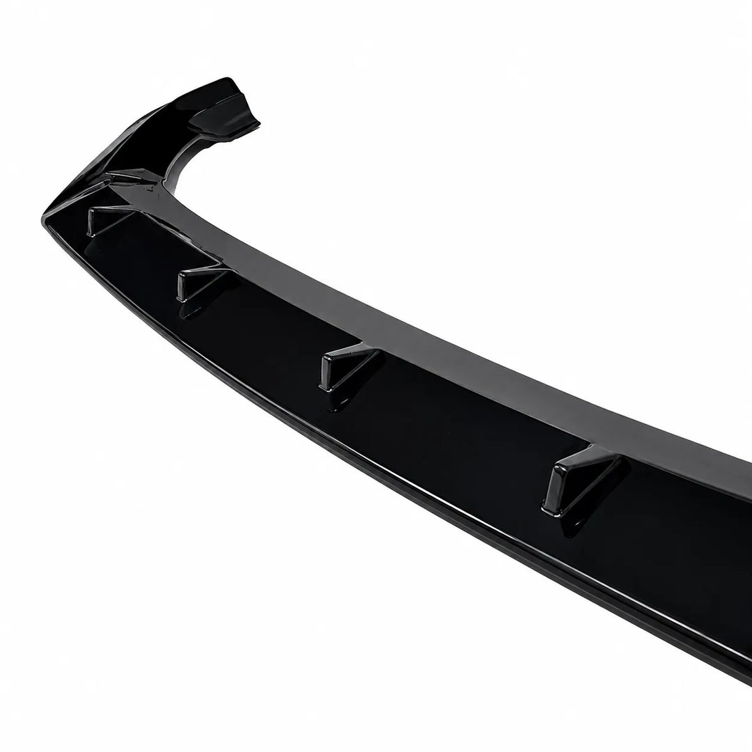 A glossy black car Q7 front bumper lip spoiler with integrated mounting points, shown at an angle on a solid white background.