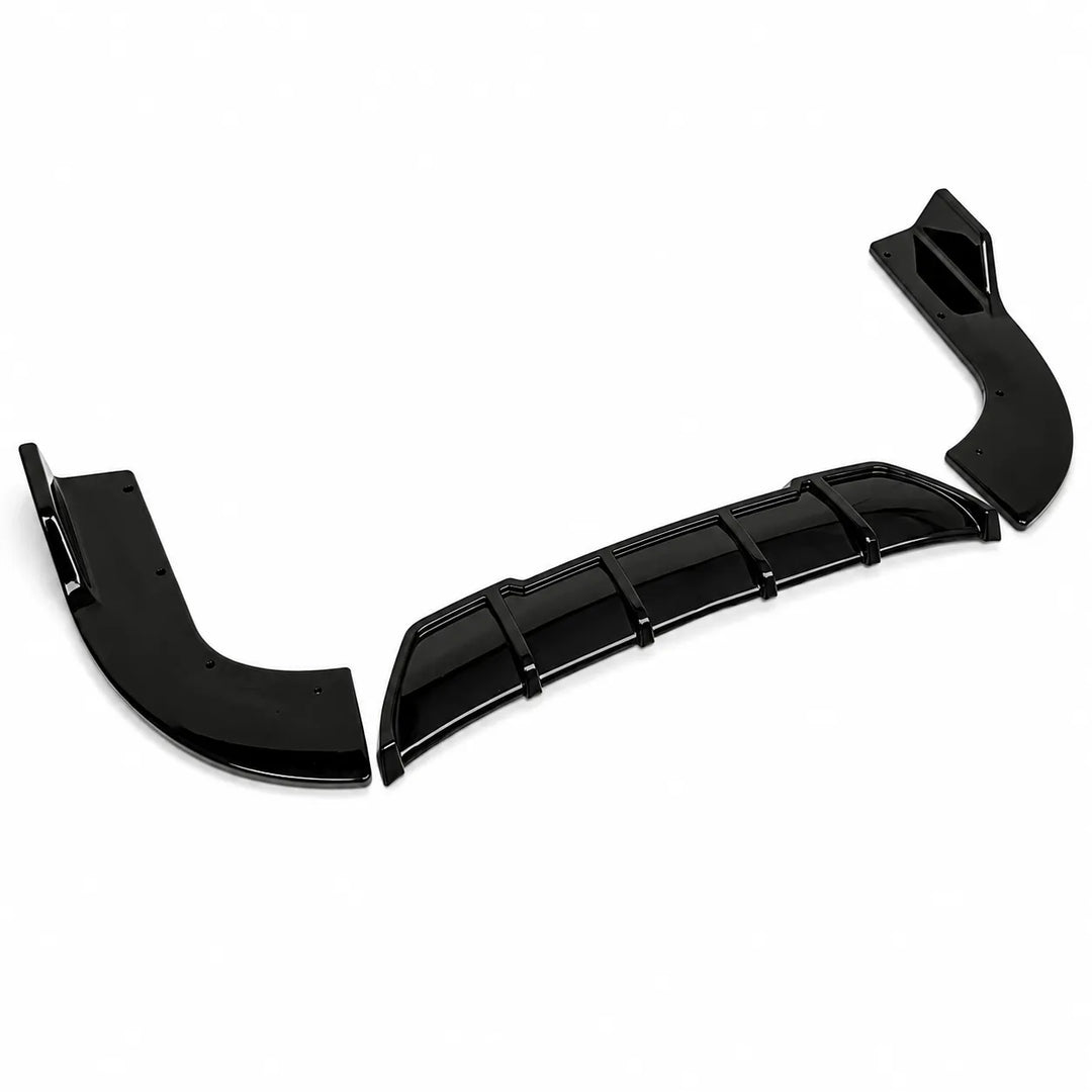 Three black glossy automotive body trim pieces, including a curved lip spoiler, a central vented trim bar, and a smaller bracket, displayed on a clean white background.