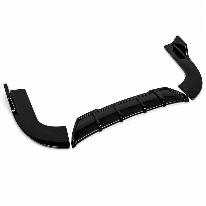 Three black glossy automotive body trim pieces, including a curved lip spoiler, a central vented trim bar, and a smaller bracket, displayed on a clean white background.