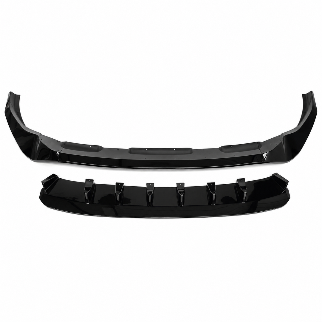 A set of glossy black automotive body trim pieces, including a lower lip diffuser splitter built up with side parts sections, displayed on a clean white background.