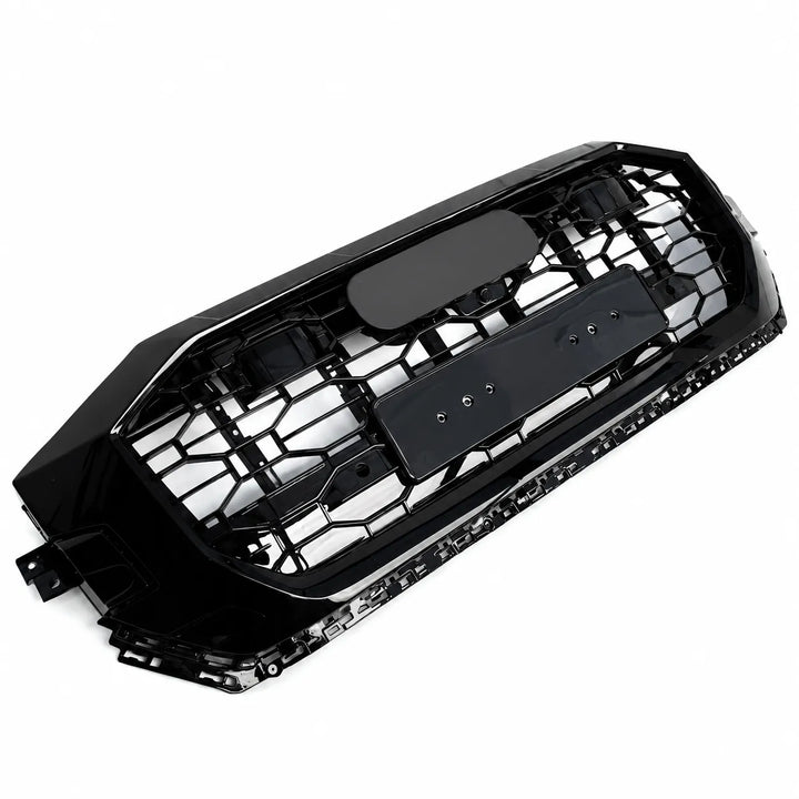 A black car Q8 Sq8 front grille with a honeycomb pattern, angled image shown on a plain white background.