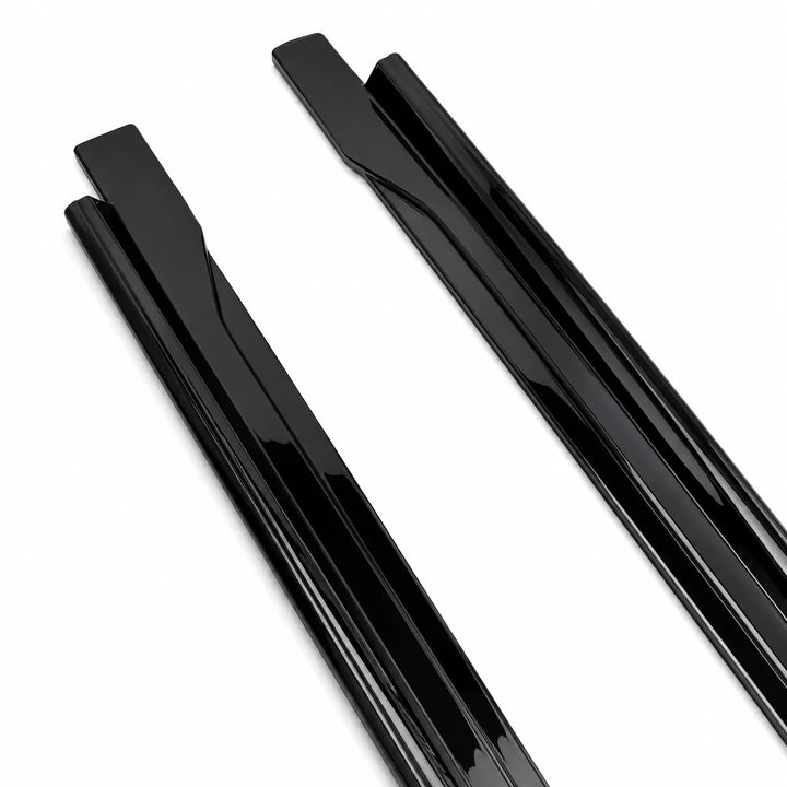 Two, single piece close up end shot of glossy black ABS plastic side track shown diagonally on a plain white background.