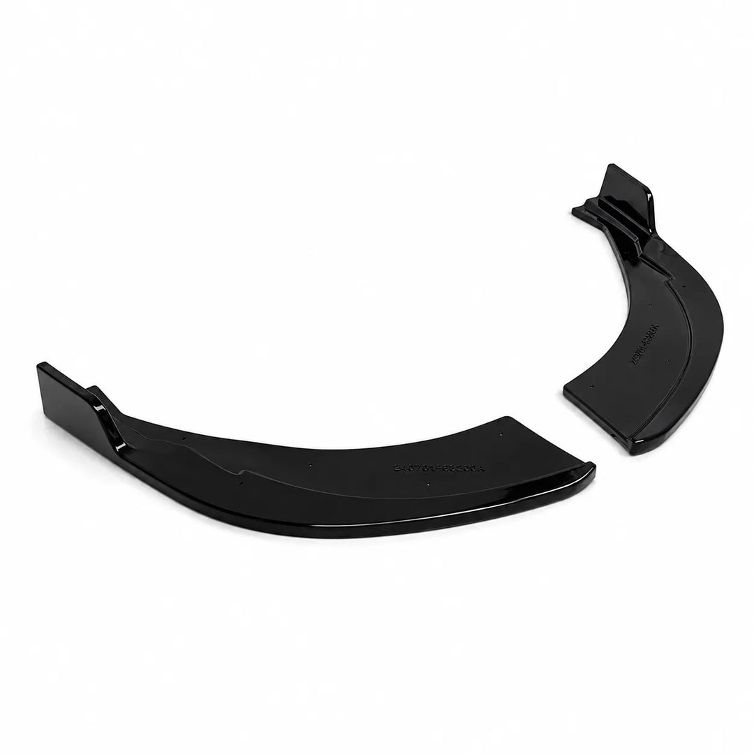 A pair of black plastic curved components, likely side spats parts, shown against a plain white background.