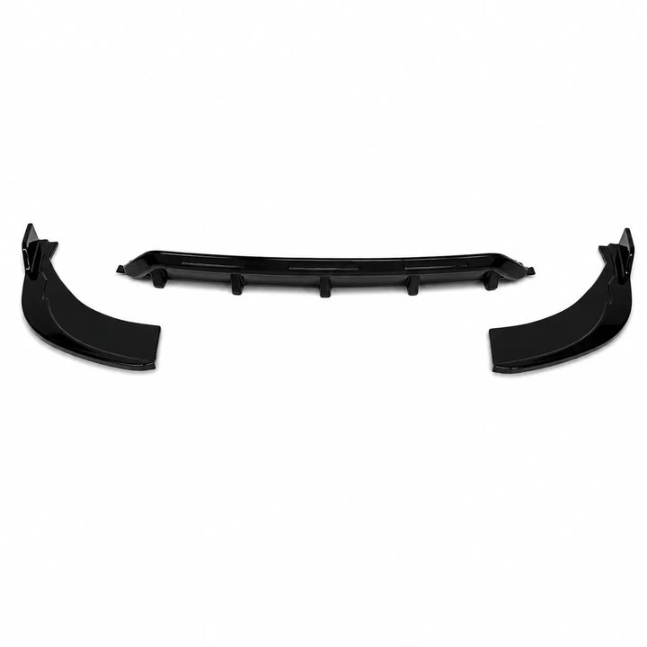 A pair of black plastic automotive rear diffuser with side spats and a matching center lip trim piece, displayed against a solid white background.