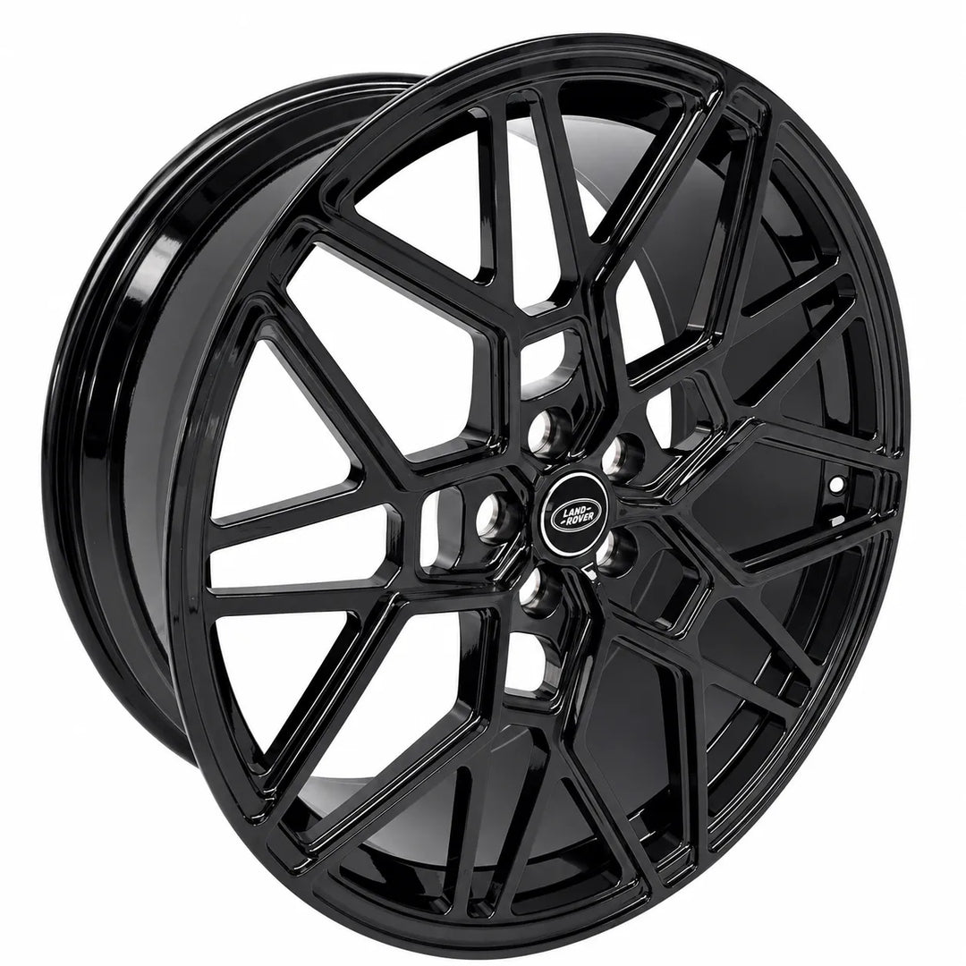 A glossy black multi-spoke alloy wheel rim with a central Land Rover badge, shown on a solid white background.