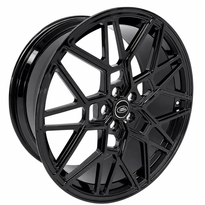 A glossy black multi-spoke alloy wheel rim with a central Land Rover badge, shown on a solid white background.