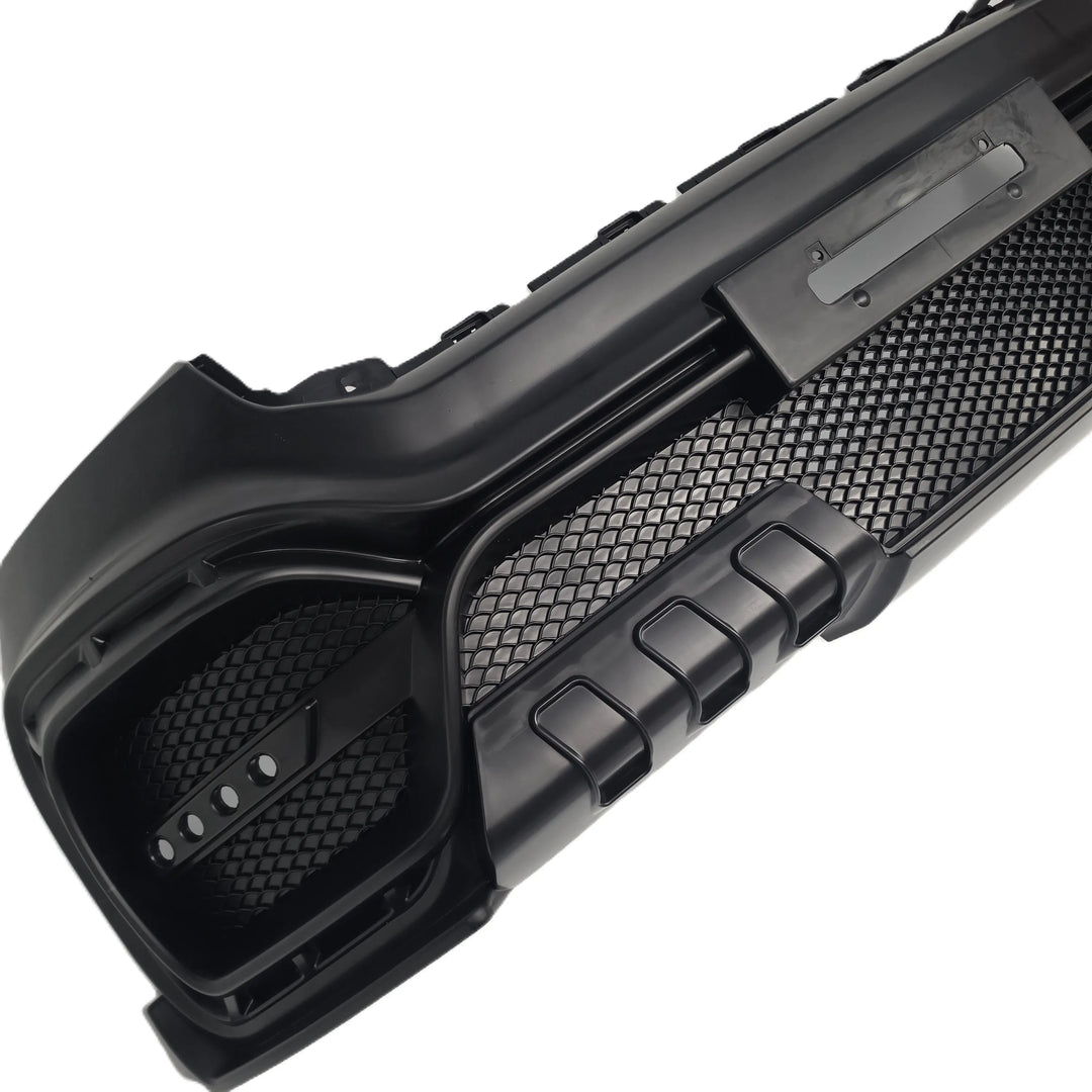 A black plastic automotive T7 Ranger upgrade AMG look bumper with a textured honeycomb pattern and integrated mounting slots, shown on a plain white background.