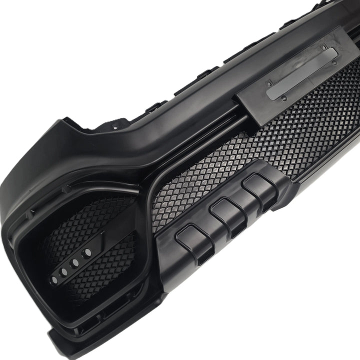 A black plastic automotive T7 Ranger upgrade AMG look bumper with a textured honeycomb pattern and integrated mounting slots, shown on a plain white background.