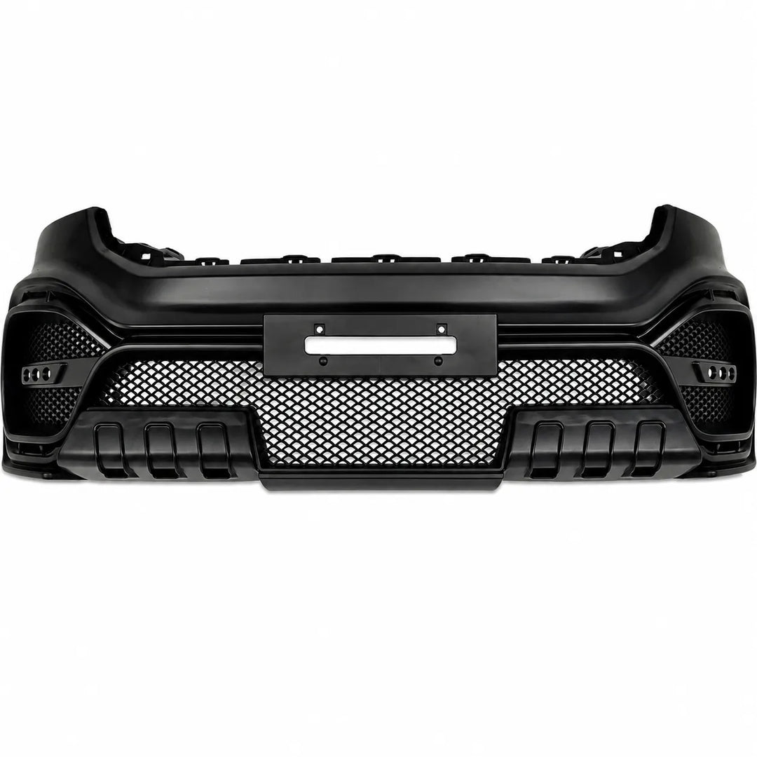 A black aftermarket car front bumper grille assembly with a honeycomb mesh pattern and integrated side fog light housings, shown against a plain white background.