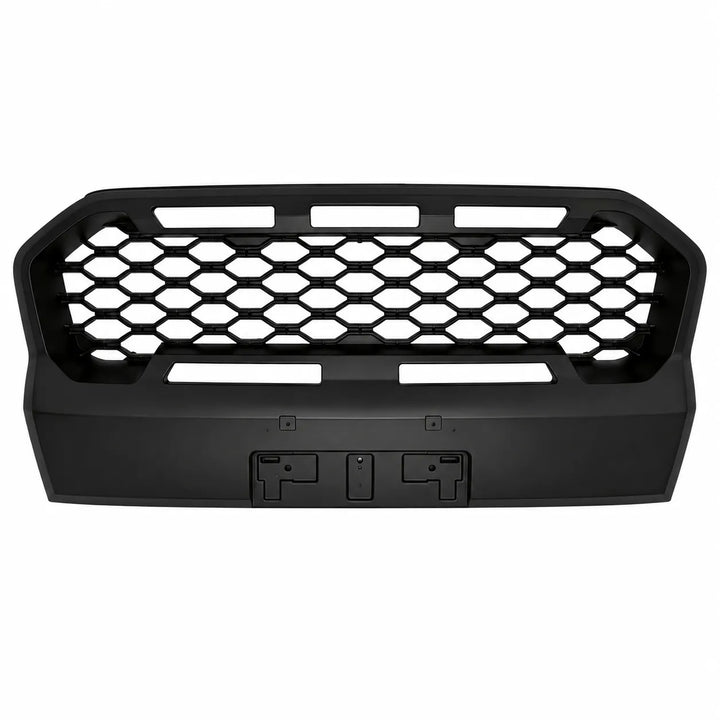 A black front grille insert with a honeycomb pattern and mounting slots, shown against a plain white background.