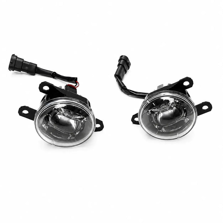 A pair of automotive fog lights with black housings, clear lenses, and attached wiring harnesses, displayed on a clean white background.