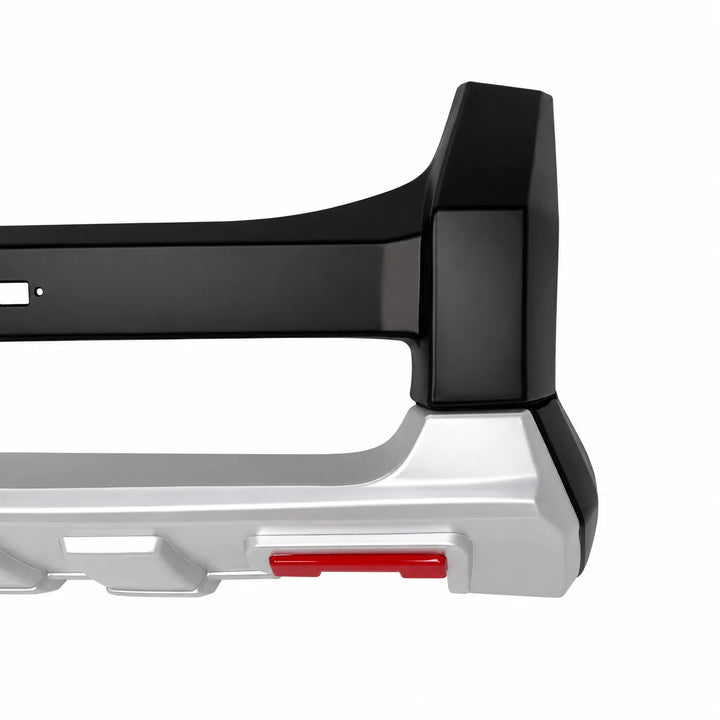 Close-up of a vehicle bumper bar or tow bar attachment with a black unpainted upper section and a silver lower section, featuring a small red accent, on a white background.