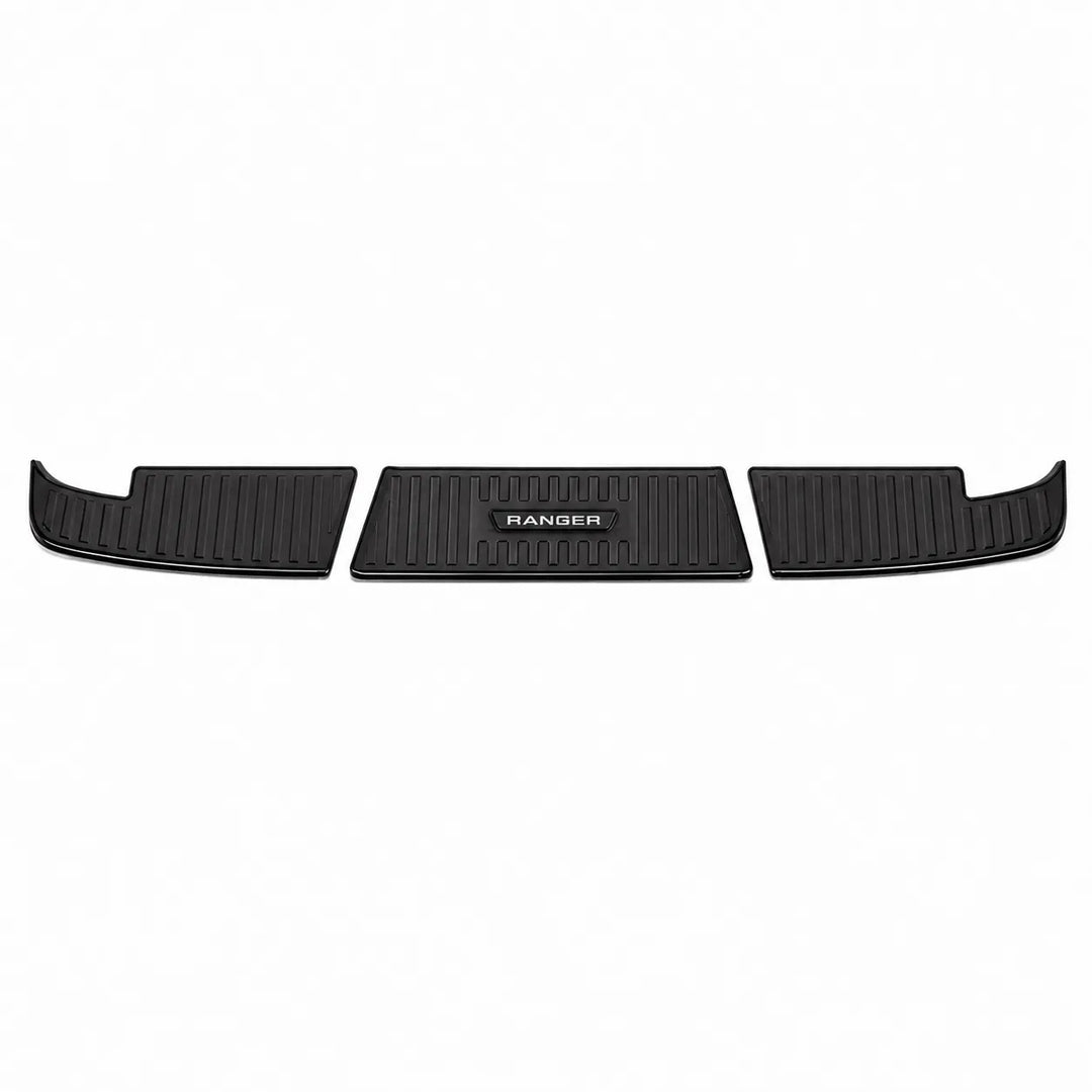 Three black metal vehicle Bumper Covers arranged horizontally on a plain white background, with the center mat showing an embossed RANGER logo.