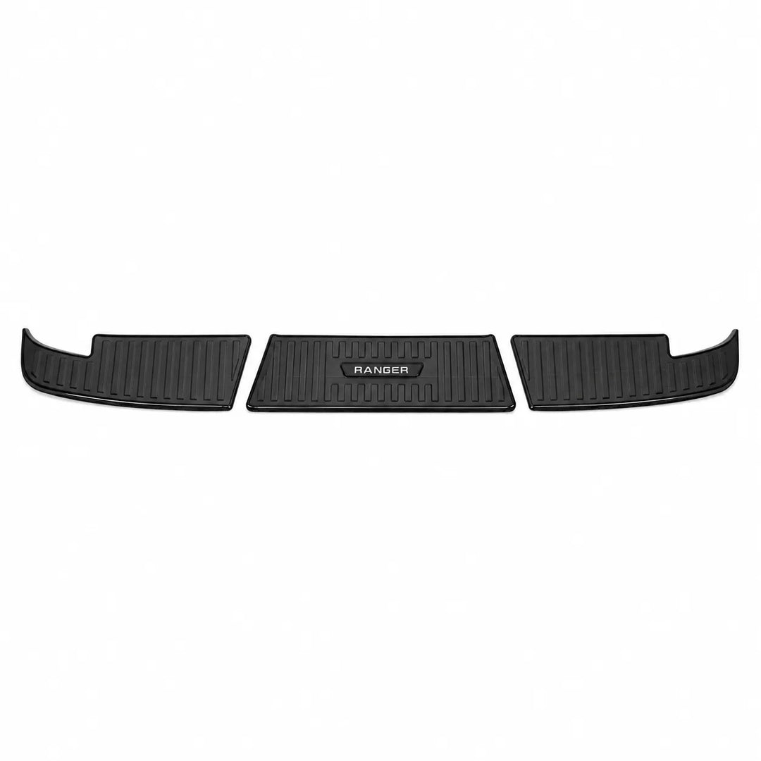 Black car bumper cover on a white background