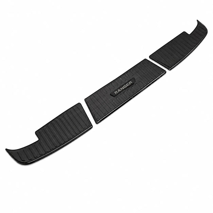 Three black metal vehicle step pads with a textured grip pattern, shown on a plain white background. The center pad features a raised black badge with the word 'RANGER' in white.