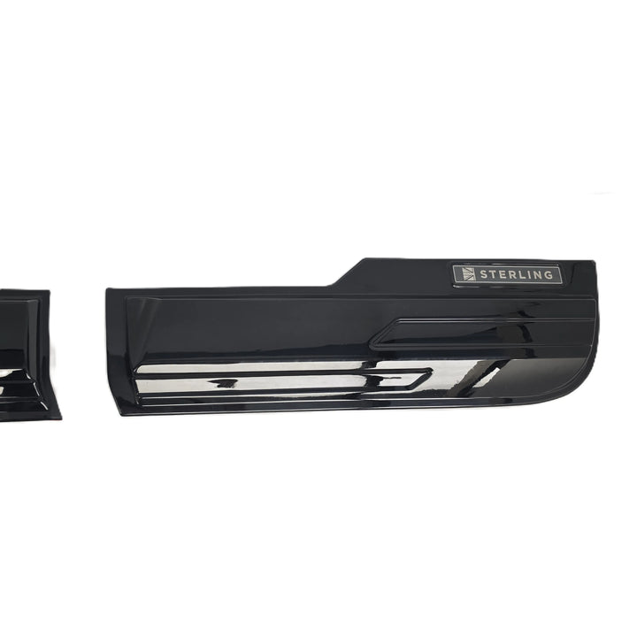 A glossy black car door handle trim piece with a silver 'STERLING' badge, shown against a plain white background.