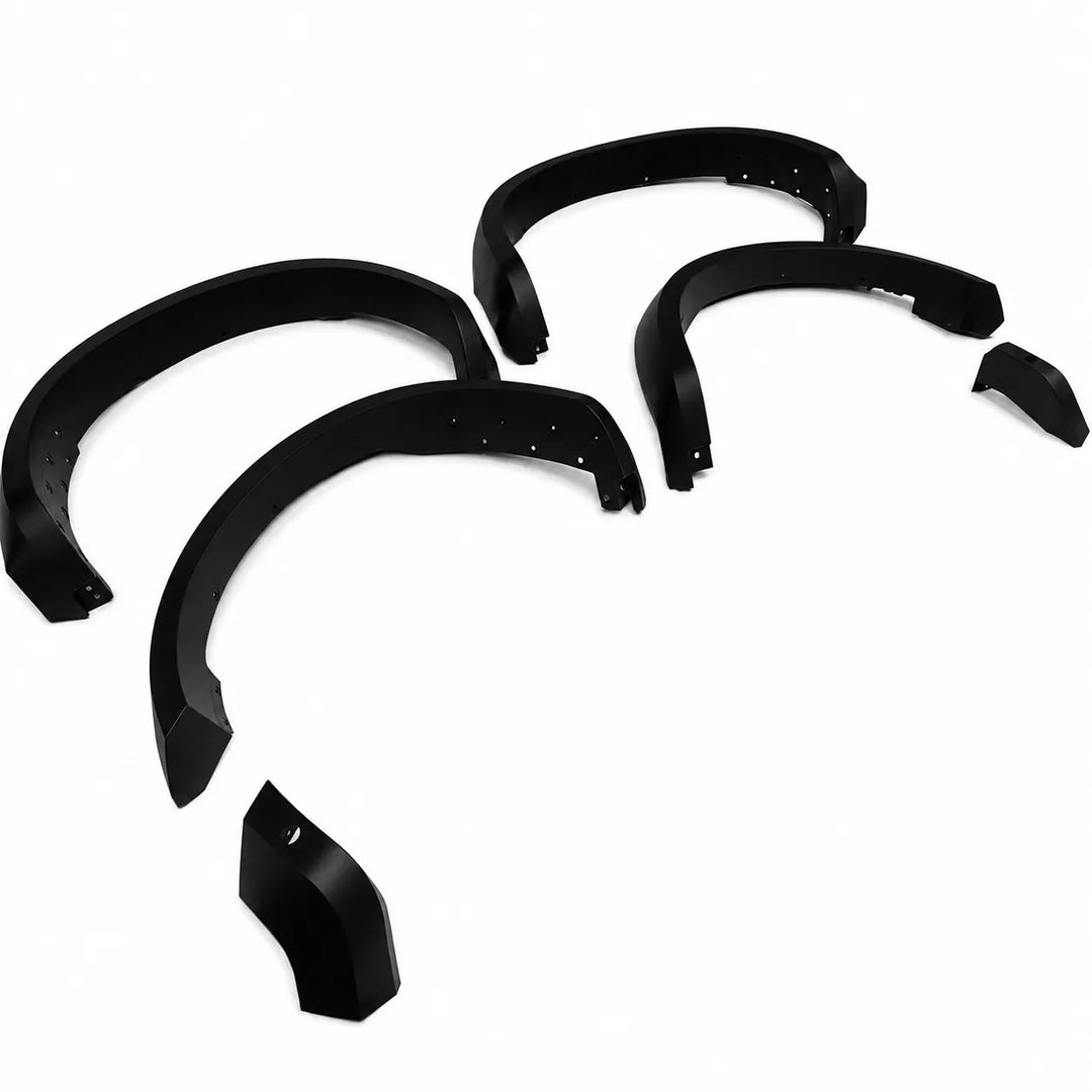 Set of black Wide Arch car fender flares for t9 raptor shot on an angle on a white background