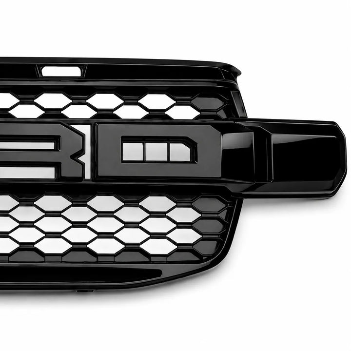 A glossy black Ford grille insert with a honeycomb pattern and a large raised 'RD' emblem, shown on a white background.