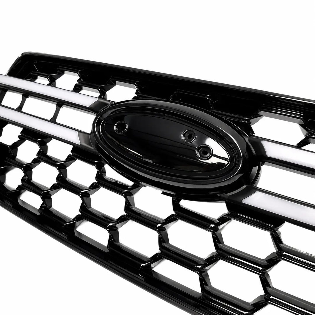 A close up shot of a glossy black honeycomb truck car grille with a central oval badge, shown on a clean white background.